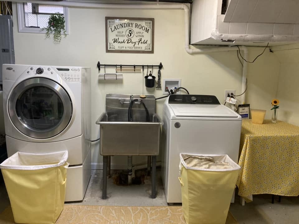 Restored basement laundry room after water damage cleanup