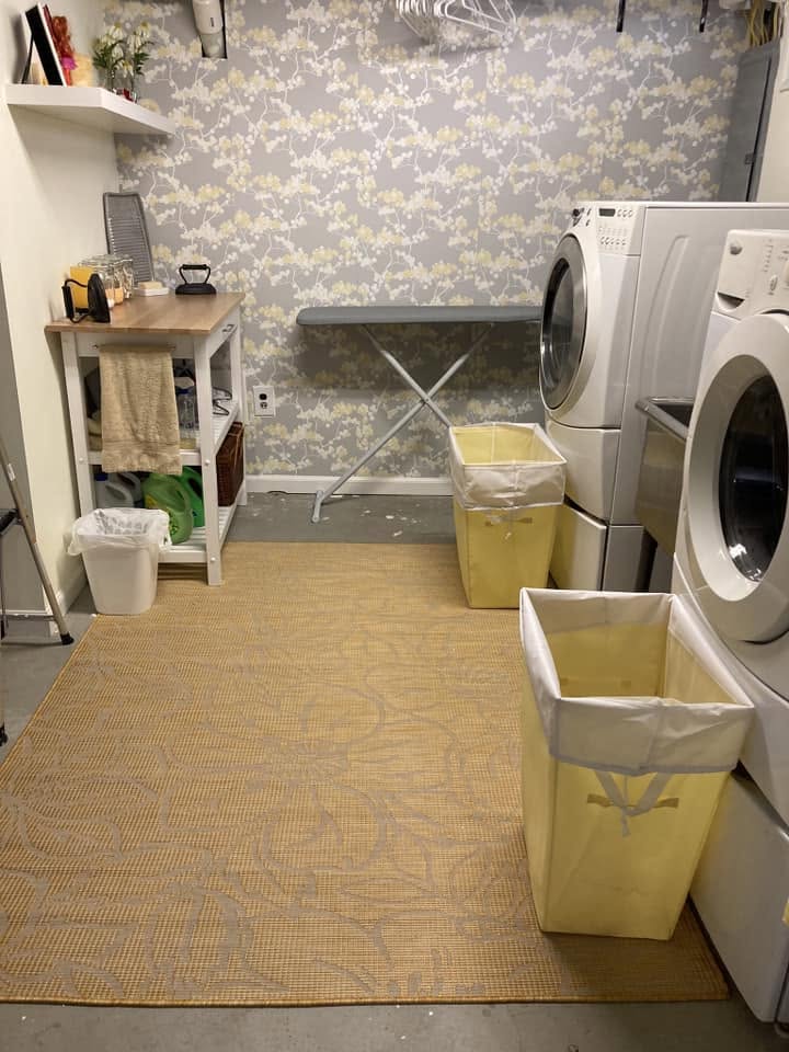 Finished basement laundry area with fresh finishes